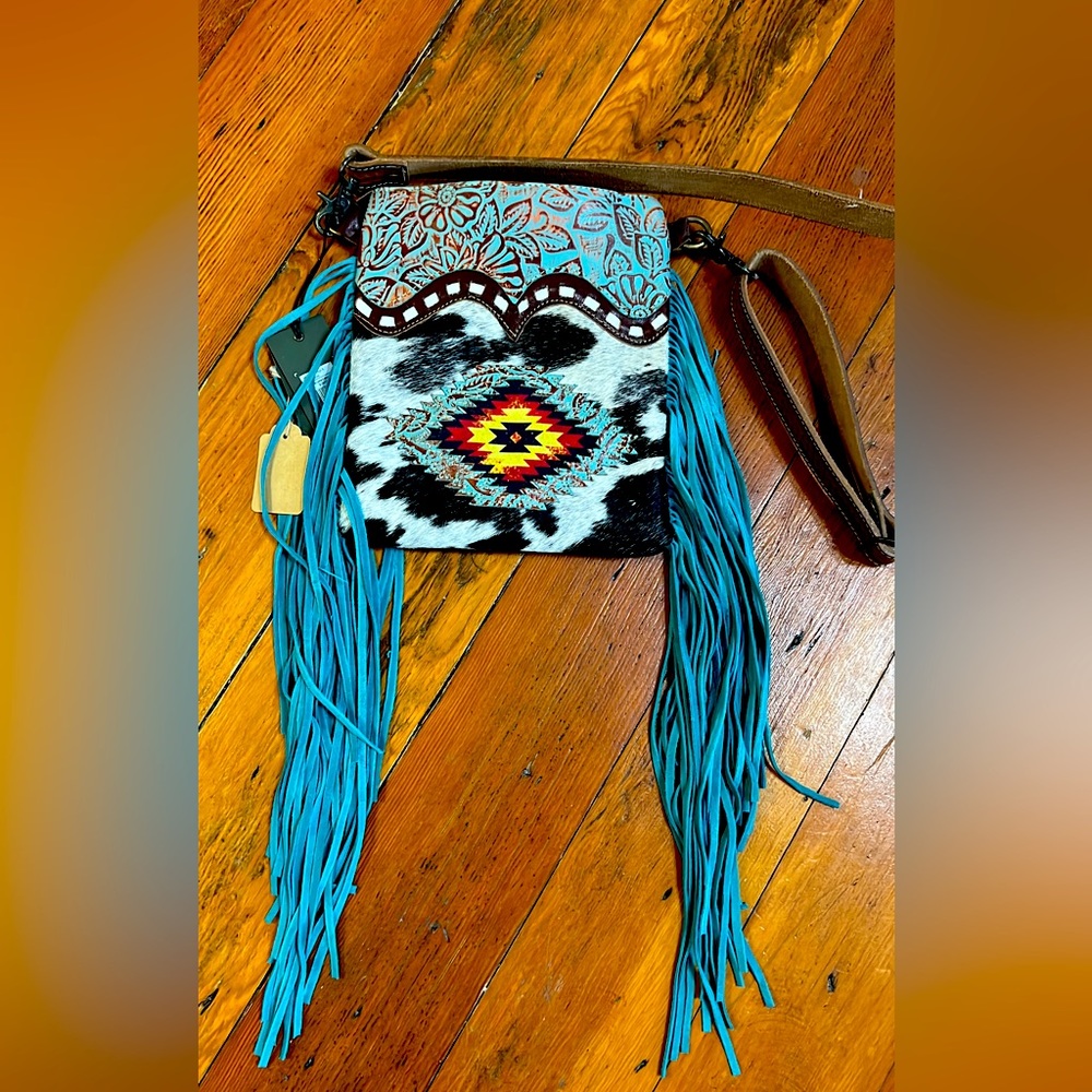 Myra Bag teal fringe cowhide purse.